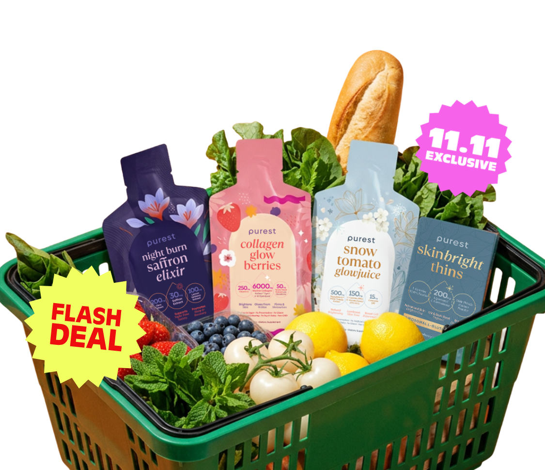 A green shopping basket of strawberries, blueberries, white tomatoes, lemons and a baguette with Night Burn Saffron Elixir, Collagen Glow Berries and Snow Tomato Glowjuice sachets and a box of Skinbright Thins